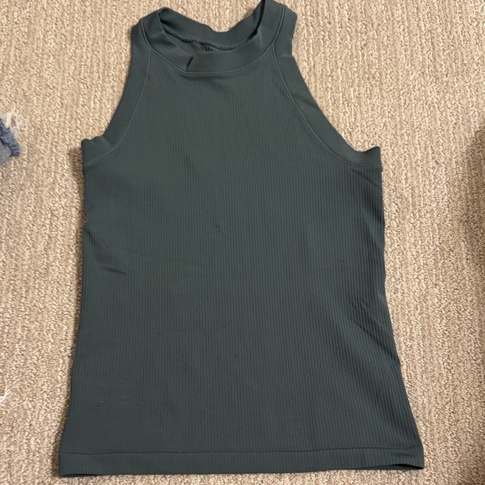 Womens Athleta tank top
Green color 
Size small
NO style tag or logo